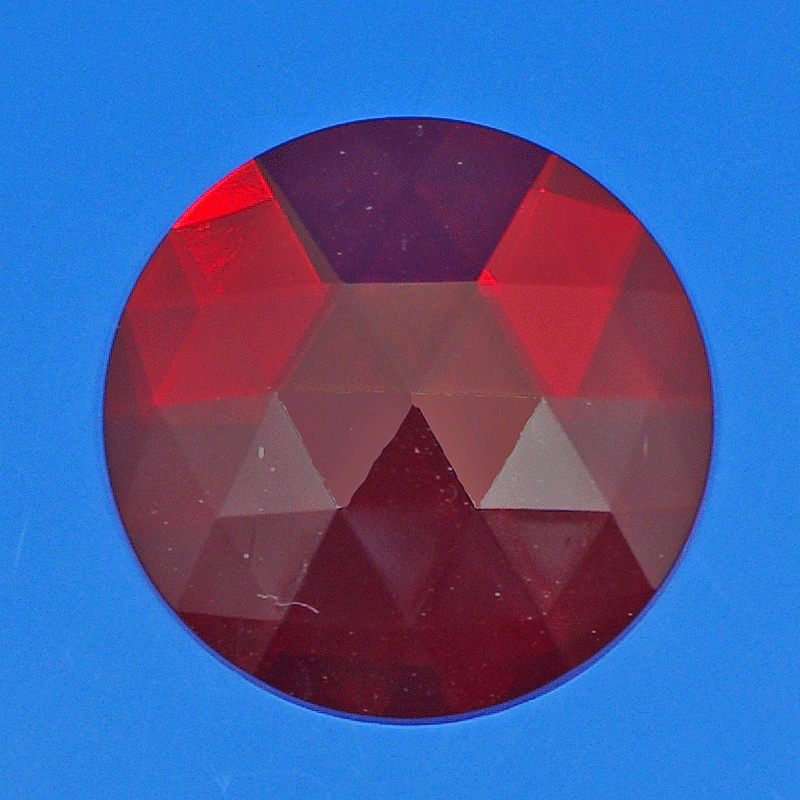 Prismatic red glass lens