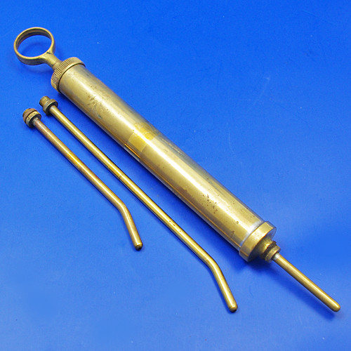 Small brass oil syringe